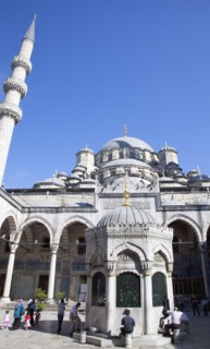 Turkey, Istanbul, Eminonu Yeni Camii New Mosque worshippers washing feet in courtyard. 
Photo :