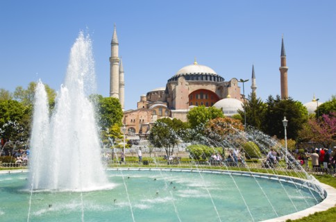 Turkey, Istanbul, Sultanahmet Haghia Sophia with dome and minarets beyond the water fountain in the