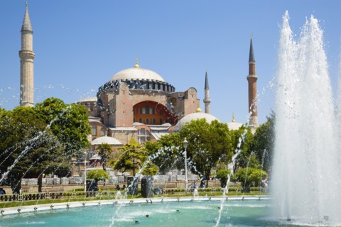 Turkey, Istanbul, Sultanahmet Haghia Sophia with dome and minarets beyond the water fountain in the