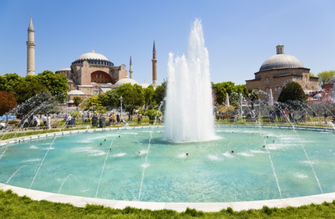Turkey, Istanbul, Sultanahmet Haghia Sophia with dome and minarets beyond the water fountain and