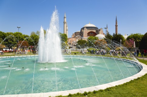 Turkey, Istanbul, Sultanahmet Haghia Sophia with dome and minarets beyond the water fountain in the