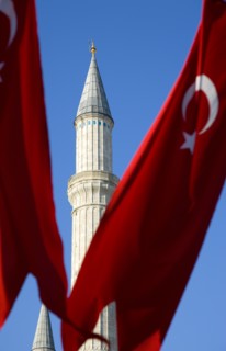 Turkey, Istanbul, Sultanahmet Haghia Sophia minaret and Turkish red flag with white crescent moon