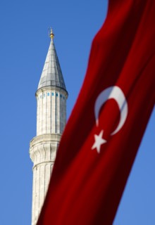 Turkey, Istanbul, Sultanahmet Haghia Sophia minaret and Turkish red flag with white crescent moon