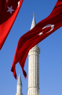 Turkey, Istanbul, Sultanahmet Haghia Sophia minaret and Turkish red flag with white crescent moon