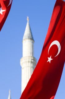 Turkey, Istanbul, Sultanahmet Haghia Sophia minaret and Turkish red flag with white crescent moon