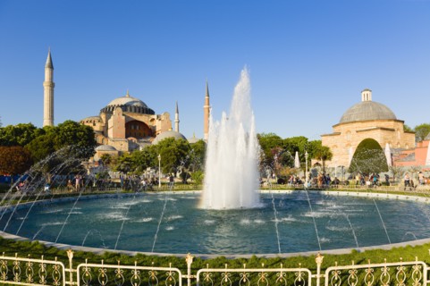 Turkey, Istanbul, Sultanahmet Haghia Sophia with dome and minarets beyond the water fountain and