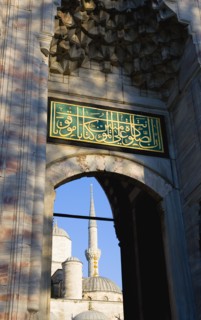 Turkey, Istanbul, Sultanahmet Camii The Blue Mosque Courtyard and minaret seen through the exit to