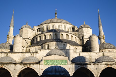 Turkey, Istanbul, Sultanahmet Camii The Blue Mosque domes seen from the Courtyard with Arabic text