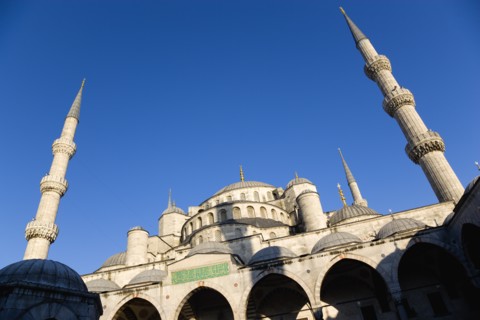 Turkey, Istanbul, Sultanahmet Camii The Blue Mosque domes seen from the Courtyard with Arabic text