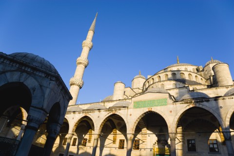 Turkey, Istanbul, Sultanahmet Camii The Blue Mosque domes seen from the Courtyard with Arabic text