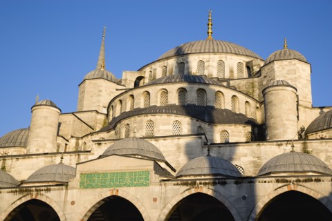 Turkey, Istanbul, Sultanahmet Camii The Blue Mosque domes seen from the Courtyard with Arabic text