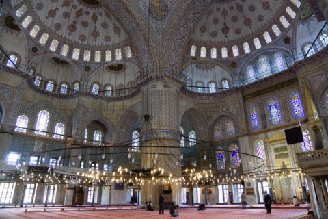 Turkey, Istanbul, Sultanahmet Camii The Blue Mosque interior with people at prayer beneath