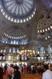 Turkey, Istanbul, Sultanahmet Camii The Blue Mosque interior with sightseeing tourists by a
