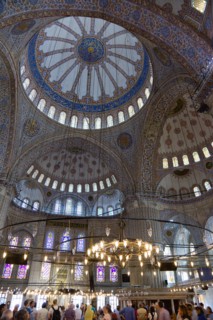 Turkey, Istanbul, Sultanahmet Camii The Blue Mosque interior with sightseeing tourists by a