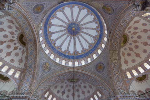 Turkey, Istanbul, Sultanahmet Camii The Blue Mosque interior with decorated painted domes. 
Photo