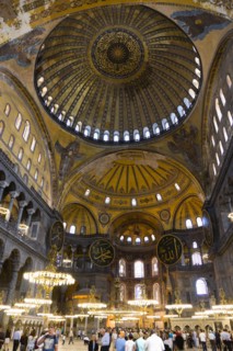 Turkey, Istanbul, Sultanahmet Haghia Sophia Sightseeing tourists beneath the dome with murals and