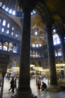 Turkey, Istanbul, Sultanahmet Haghia Sophia Sightseeing tourists beneath the dome with murals and