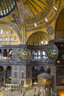 Turkey, Istanbul, Sultanahmet Haghia Sophia Sightseeing tourists beneath the dome with murals and