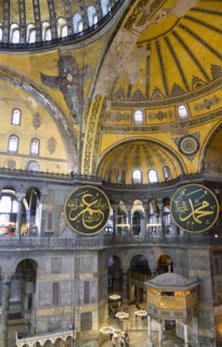 Turkey, Istanbul, Sultanahmet Haghia Sophia Sighseeing tourists beneath the dome with murals and