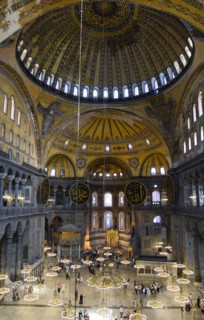 Turkey, Istanbul, Sultanahmet Haghia Sophia Sightseeing tourists beneath the dome with murals and