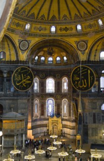 Turkey, Istanbul, Sultanahmet Haghia Sophia Sightseeing tourists beneath the dome with murals and