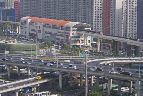China, Shanghai, Light Railway train leaving Caoxi Road station in south Shanghai in the early