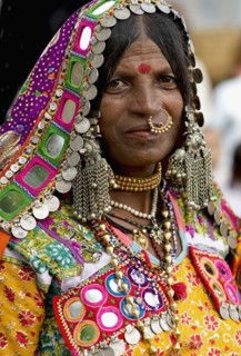 PORTRAIT OF A LAMBANI GYPSY TRIBAL WOMAN WITH TRADITIONAL TRIBAL JEWELRY AND COSTUME, INDIA. (MR)