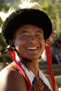 PORTRAIT OF A TRIBAL FROM A NAGA WARRIOR TRIBE WEARING TRADITIONAL COSTUME AND JEWELRY, NAGALAND, NORTH EAST INDIA