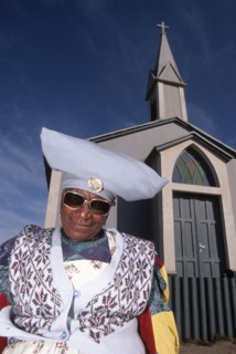 Namibia, Mondesa, Herero woman in Mondesa the township of Walvis Bay Namibia standing next to a