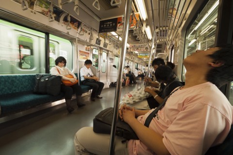 Japan, Honshu, Tokyo, Commuters asleep on train. 
Photo : Jon Burbank