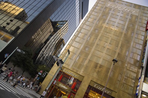 Japan, Honshu, Tokyo, Ginza Golden facade of the Cartier Building with the Chanel Building on left
