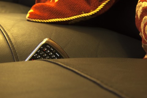 Communications, Telephones, Mobile, Phone stuck between cushions of leather sofa. 
Photo : Stephen