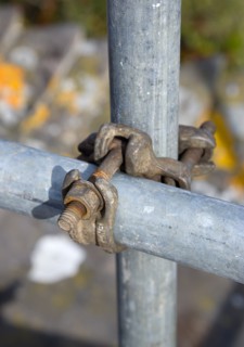 Architecture, Construction, Building, Detail of scaffolding double coupler attached to poles.