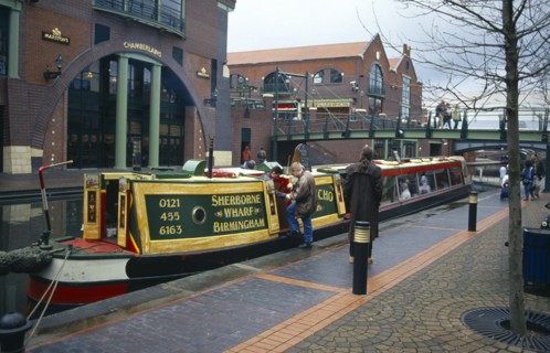 Canal barge tourist boat next to the International Conference Centre