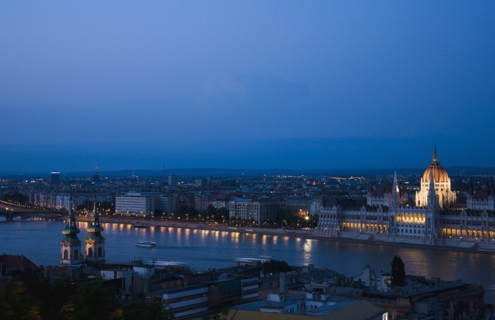 Buda Castle District view over Danube and Pest with Parliament Building illuminated.