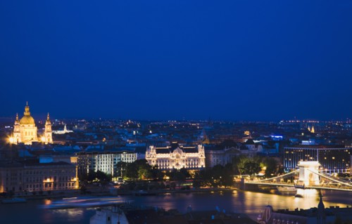 Buda Castle District view over Danube and Pest with St Stephen's Basilica illuminated.