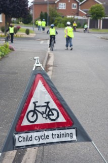 School children being taught cycle safety lessons on public roads.