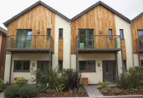 Graylingwell Park Modern housing with solar panels blended seamlessly in to roof tiles.