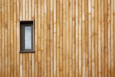 Graylingwell Park detail of wood cladding on the exterior of the modern eco friendly house.