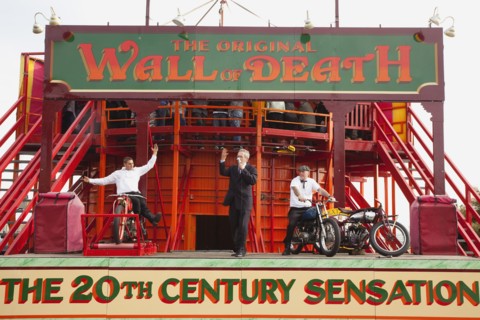 Wall of death motorcycle fairground attraction on Madeira Drive during motorbike festival.