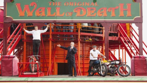 Wall of death motorcycle fairground attraction on Madeira Drive during motorbike festival.