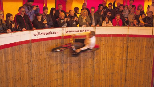 Wall of death motorcycle fairground attraction on Madeira Drive during motorbike festival.