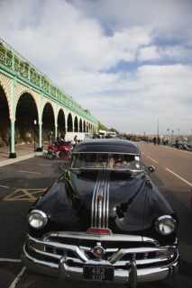 Old American Pontiac automobile on Madeira Drive during classic car festival.