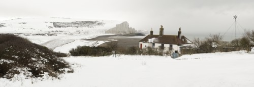 Seven Sisters Snow covered chalk cliffs viewed from the coastguard cottages at Cuckmere Haven.
