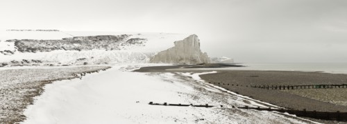 Seven Sisters Snow covered chalk cliffs viewed from the coastguard cottages at Cuckmere Haven.
