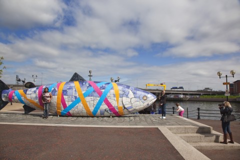 Donegall Quay The Big Fish Sculpture by John Kindness. The scales of the fish are pieces of printed blue tiles with details of Belfasts history. The 10 metre long structure is situated beside the Laga...