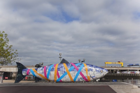 Donegall Quay The Big Fish Sculpture by John Kindness. The scales of the fish are pieces of printed blue tiles with details of Belfasts history. The 10 metre long structure is situated beside the Laga...