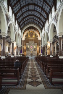 Falls Road Clonard Monastery interior decorated for Good Friday with statues draped in purple cloth.