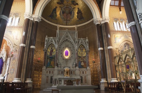 Falls Road Clonard Monastery interior decorated for Good Friday with statues draped in purple cloth.