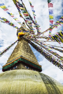 Boudhanath Stupa near Kathmandu, with coloutful prayer flags.
